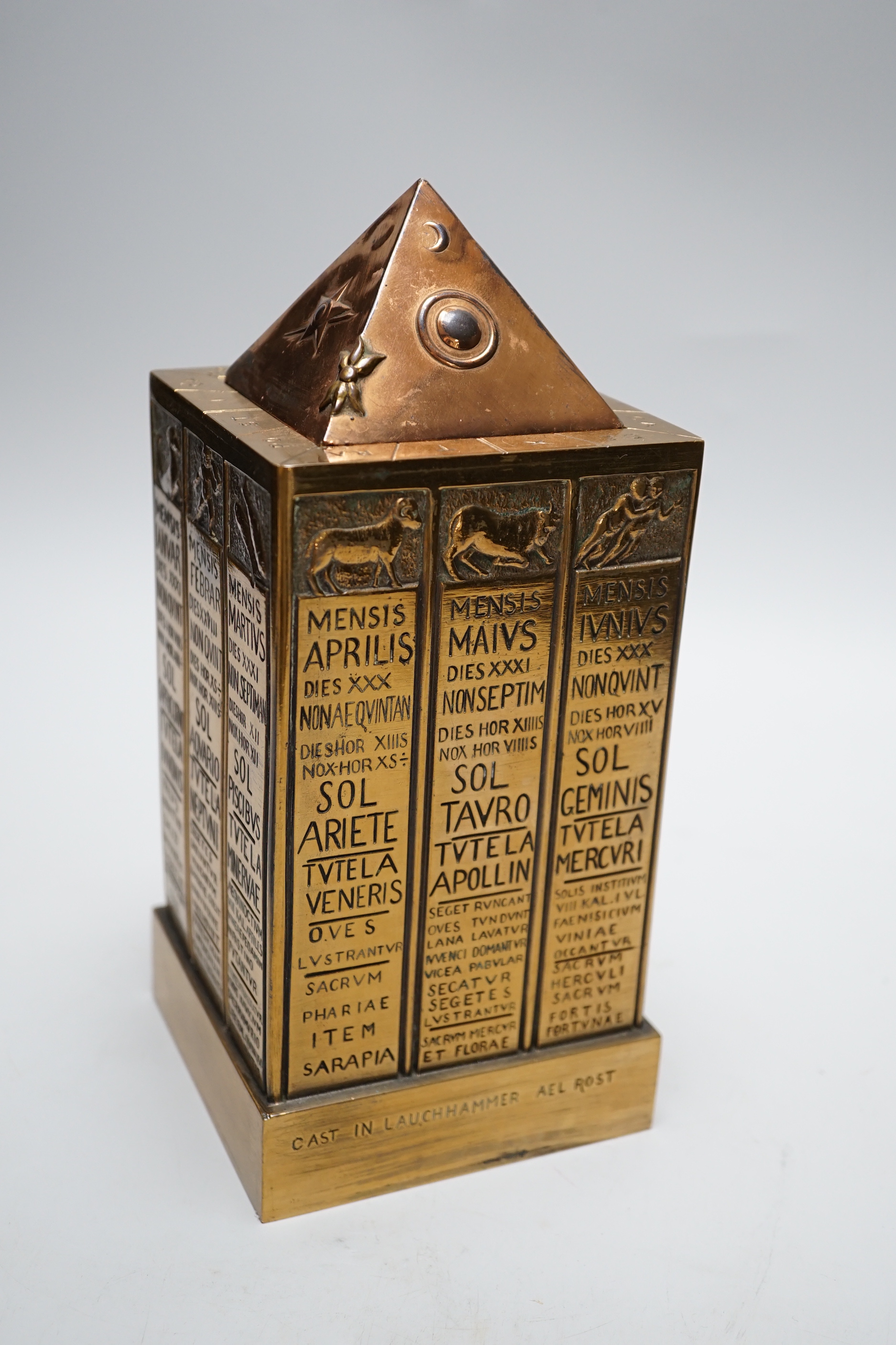 A German astrological cast stand together with a Masonic ceremony book, tallest 23cm